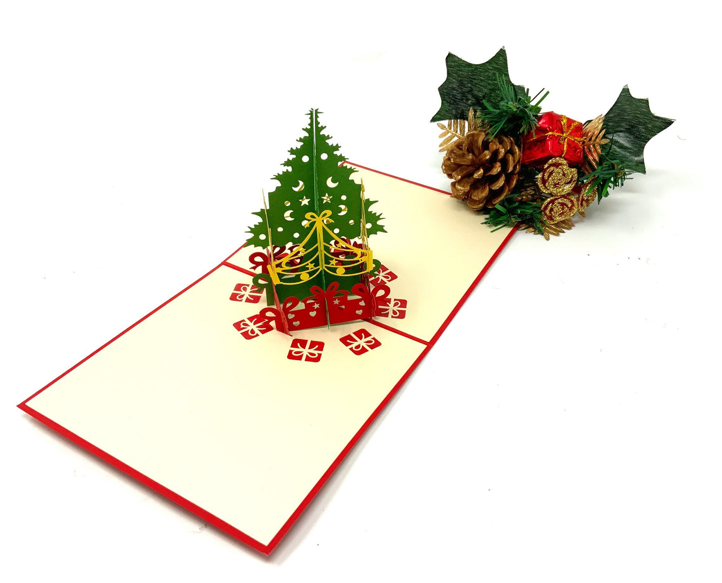"A 4-pack of mini Christmas tree pop-up cards: A collection of four small three-dimensional cards, each featuring an intricately crafted pop-up of a Christmas tree, perfect for celebrating the holiday season in a compact size."