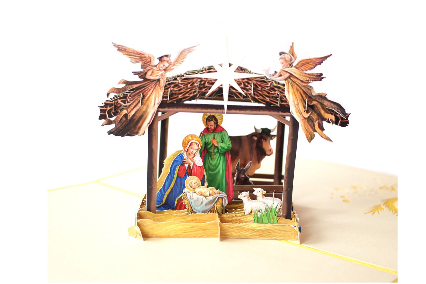 "Nativity scene pop-up card: A three-dimensional card with an intricately crafted pop-up of a nativity scene, perfect for celebrating the Christmas season and conveying the story of the birth of Jesus."