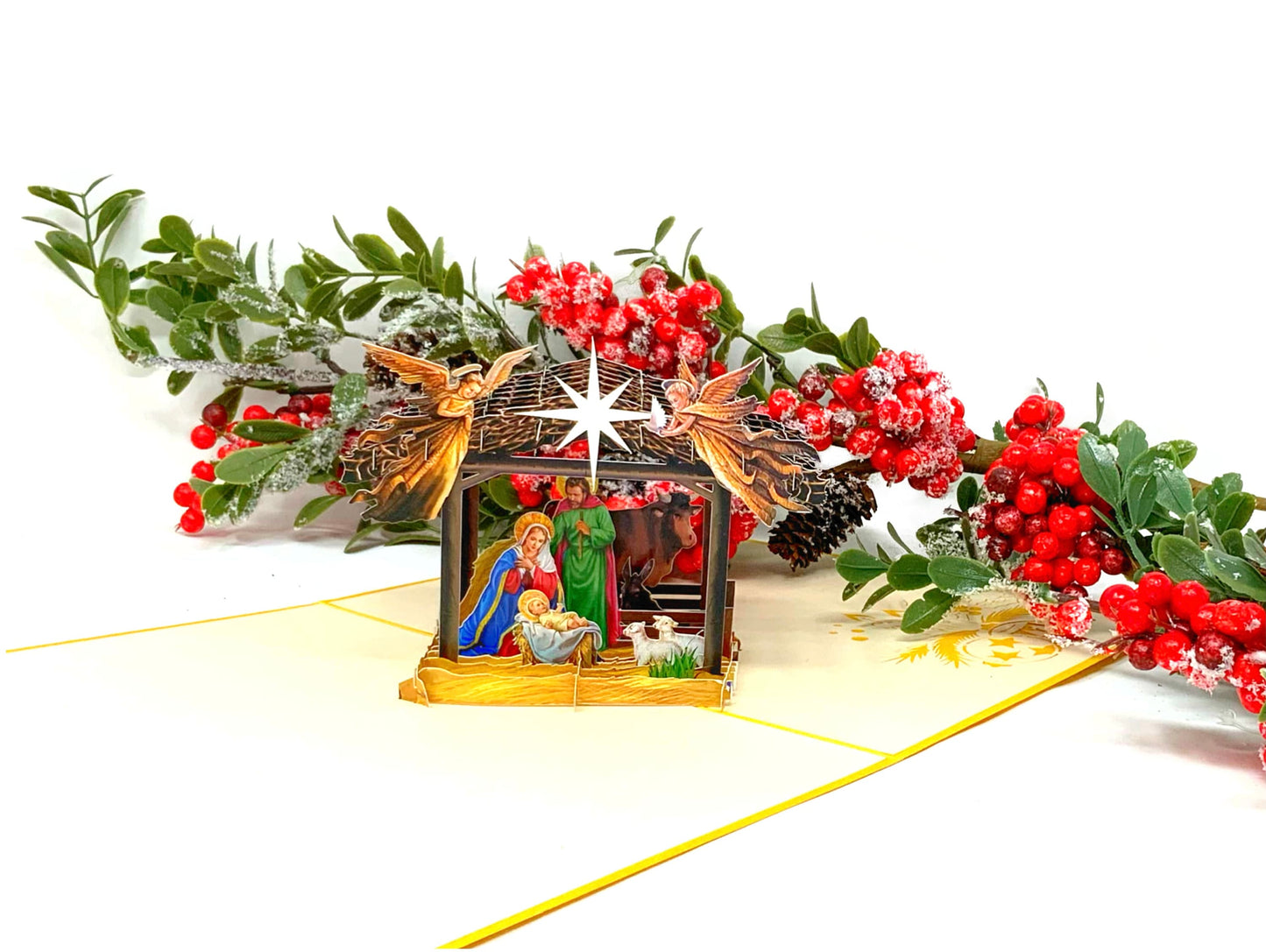 "Nativity scene pop-up card: A three-dimensional card with an intricately crafted pop-up of a nativity scene, perfect for celebrating the Christmas season and conveying the story of the birth of Jesus."