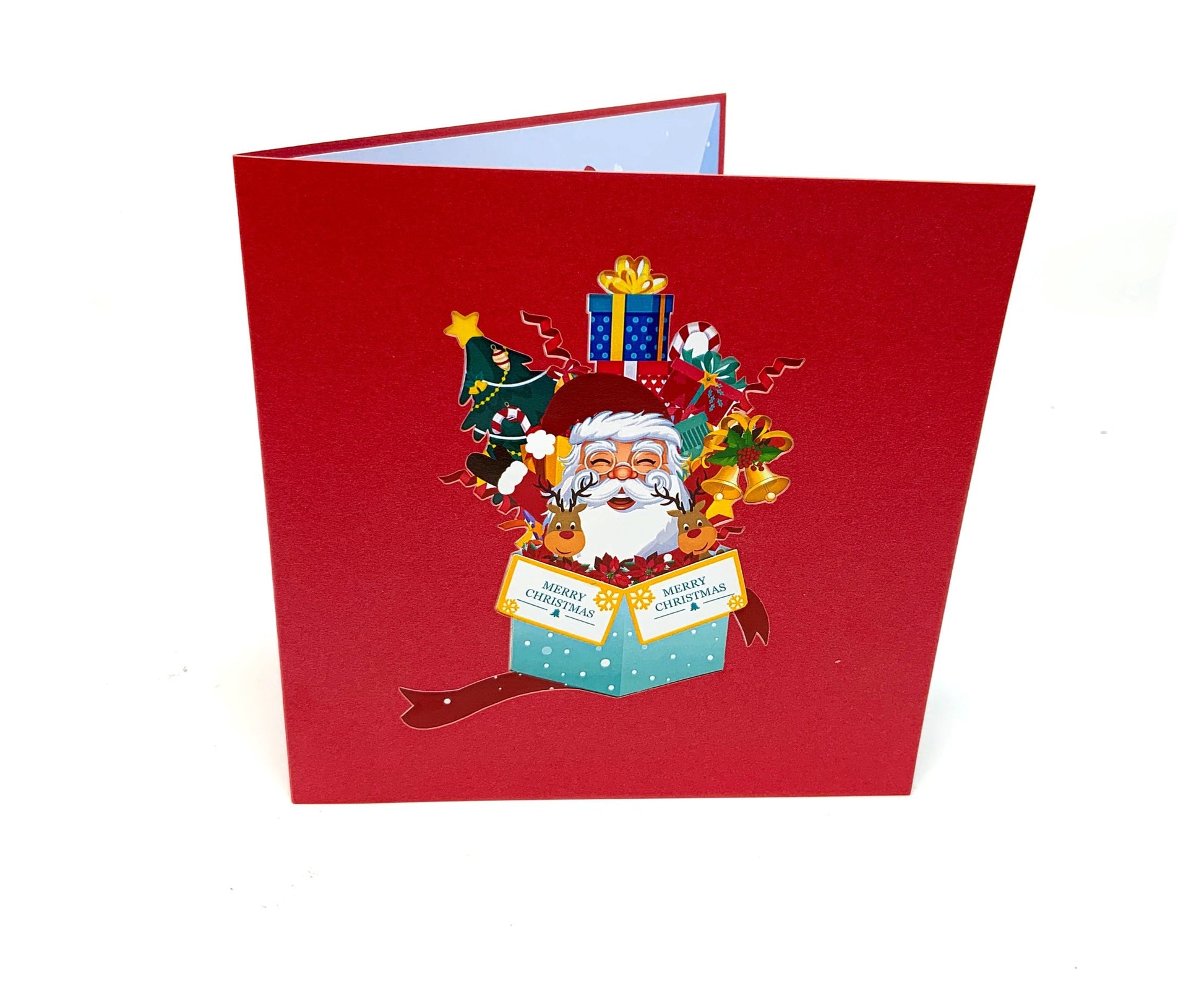 &quot;Front cover of the Santa in a Box pop-up card: The cover features an inviting and festive design with an image that hints at the intricate pop-up scene featuring Santa Claus inside, perfect for adding holiday cheer to various occasions.&quot;