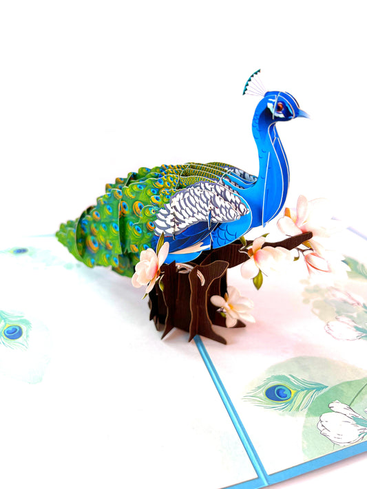 &quot;Peacock-themed pop-up card: A three-dimensional card with an intricately crafted pop-up scene featuring a beautiful peacock, perfect for various occasions and nature enthusiasts.&quot;