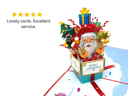 &quot;Santa in a Box pop-up card with a 5-star review: A three-dimensional card featuring an intricately crafted pop-up scene with Santa Claus in a festive box, accompanied by a 5-star rating indicating high customer satisfaction