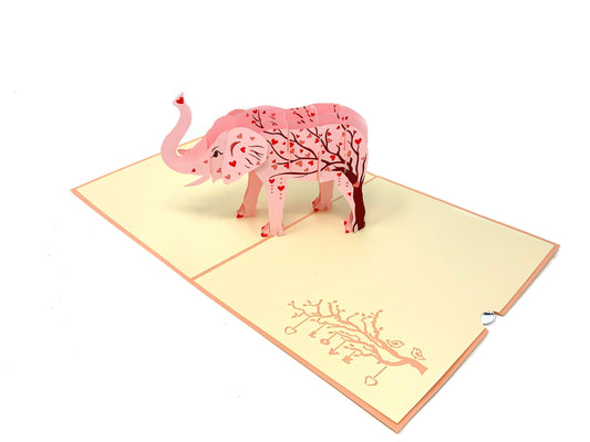 &quot;Pink elephant-themed pop-up card: A three-dimensional card with an intricately crafted pop-up scene featuring a pink elephant, perfect for various occasions and charming designs.&quot;